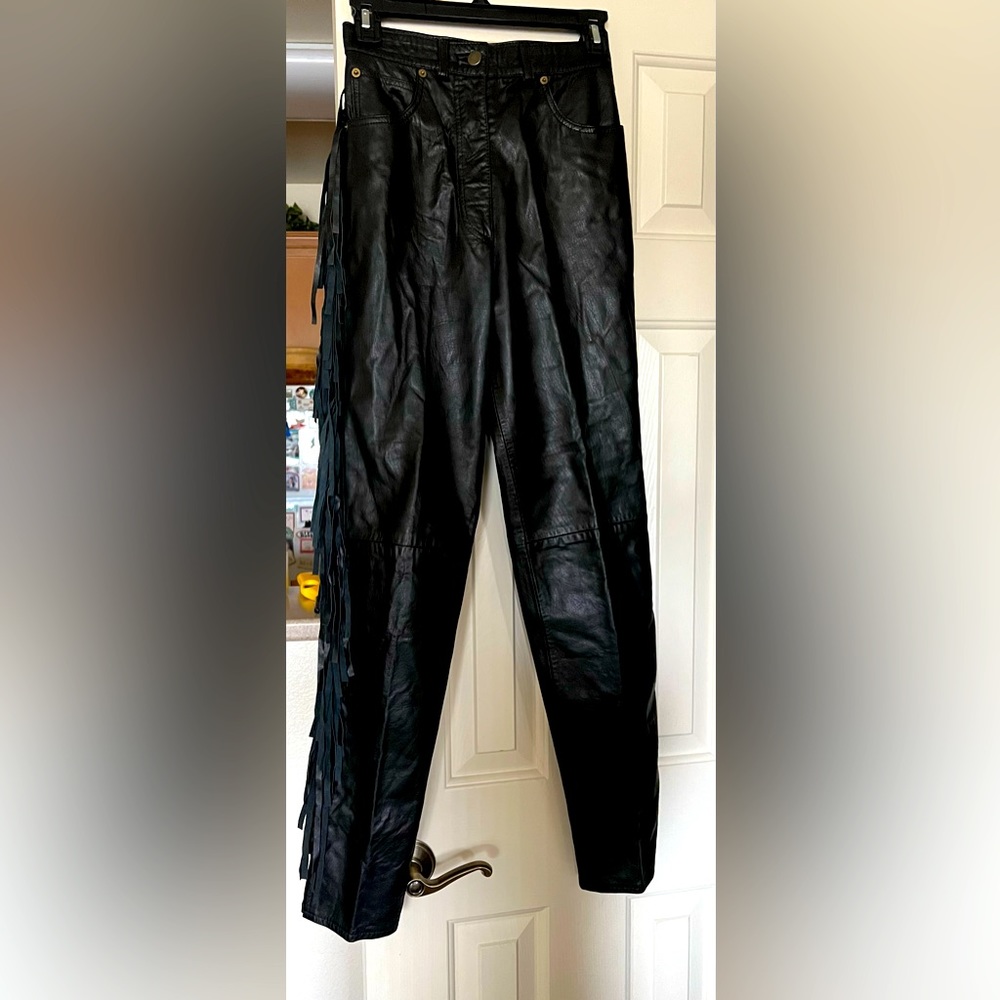 Ladies vintage leather pants with fringe on the sides. Very fun! Size XS.